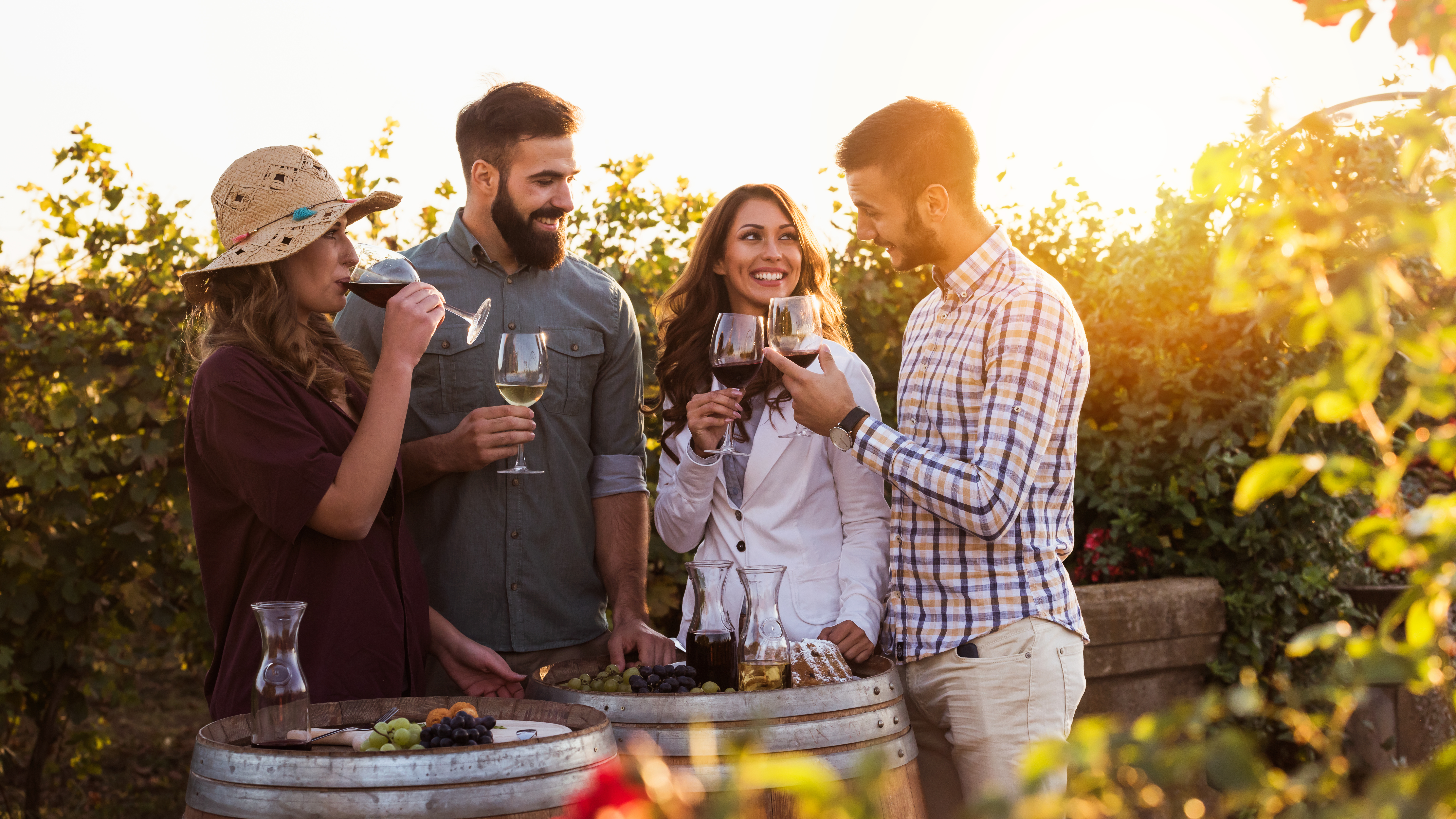 AI for wineries — friends sharing a sunset tasting in an estate vineyard